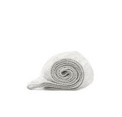 Boll and Branch signature hemmed fitted crib sheet secures standard crib.