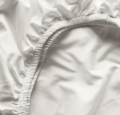Boll and Branch soft organic cotton crib sheet for a gentle baby sleep.