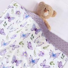 BORITAR blanket shows purple butterfly pattern adding cheerful color to the nursery