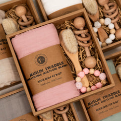 BoxLux newborn gift box features a wooden rattle for early sensory play