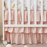 Brandream blush pink crib skirt with ruffles for a charming four-sided fit around a standard crib.