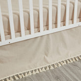 Brandream crib bed skirt in beige boho style adds soft texture to the nursery.