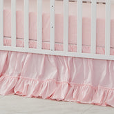 Brandream crib bed skirt in blush pink adds soft nursery color