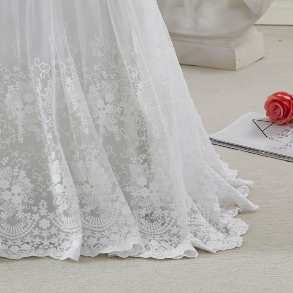 Brandream crib skirt with lace edge in cream adds vintage charm to the nursery.