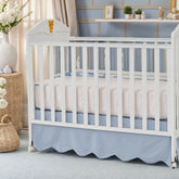 Brandream scallop edge crib skirt in mist blue enhances nursery elegance and tidies under-crib space.
