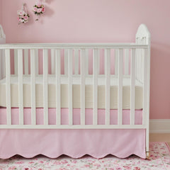 Brandream scallop edge crib skirt in pink gingham adds charm while hiding under-crib storage.