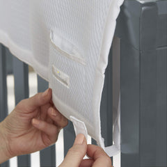 BreathableBaby railguard-pocket demonstrates pacifier and teether within reach.