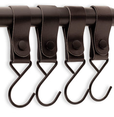 Brute Strength stroller hook assembly in use, securing a stroller handle with metal loops.