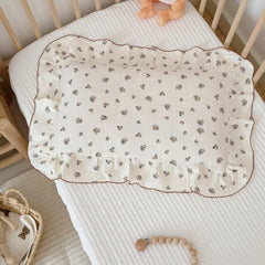 BuLuTu muslin pillow cover close-up of pansy dots and ruffle edge for gentle bedtime comfort.