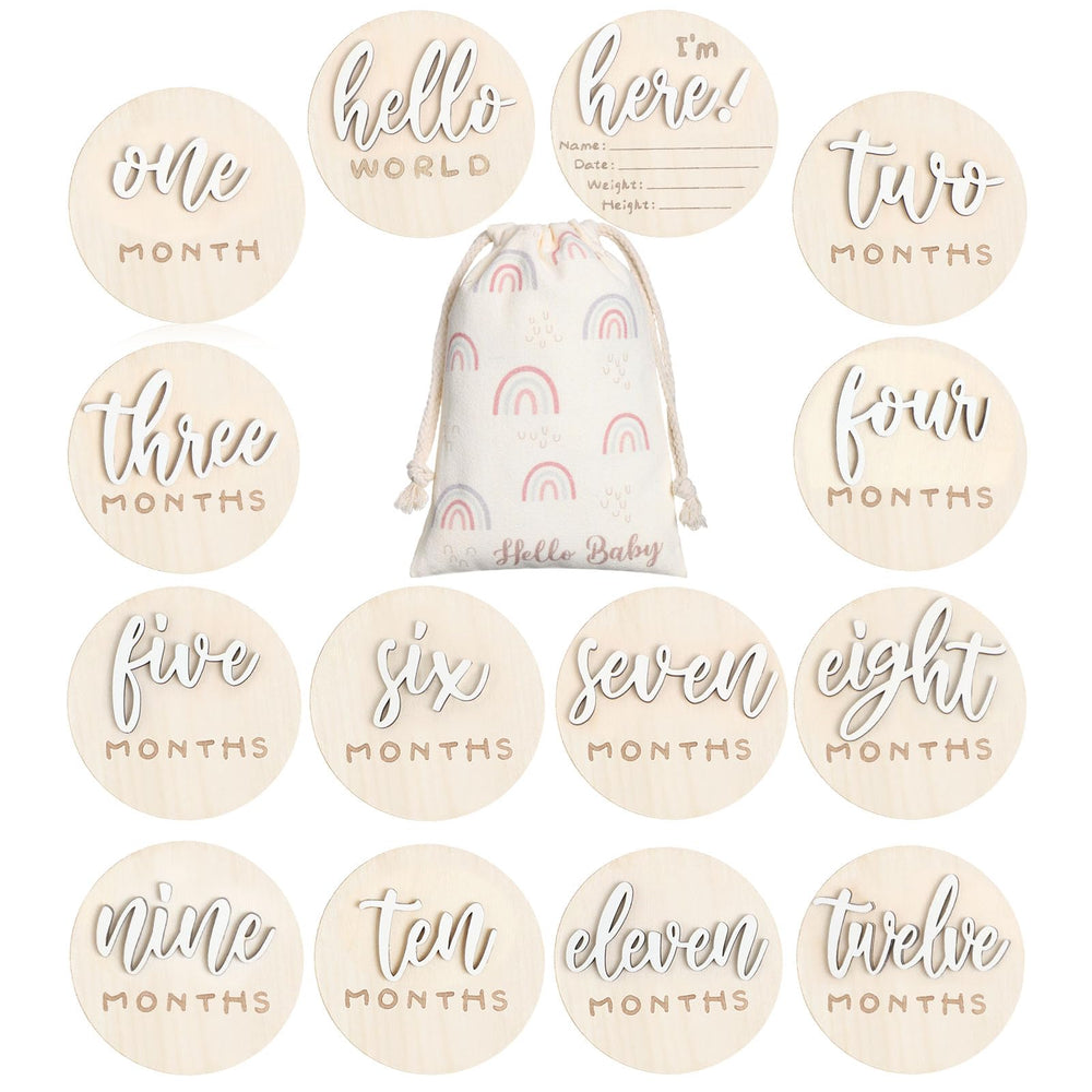 Burbell 7 Pack 3D milestone discs placed in a newborn photo setup, highlighting monthly growth.