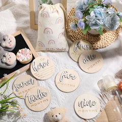 Burbell double-sided milestone discs showing months and Hello World for photo props.