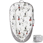 BUTOA baby lounger with breathable cover for comfortable supervised lounging.