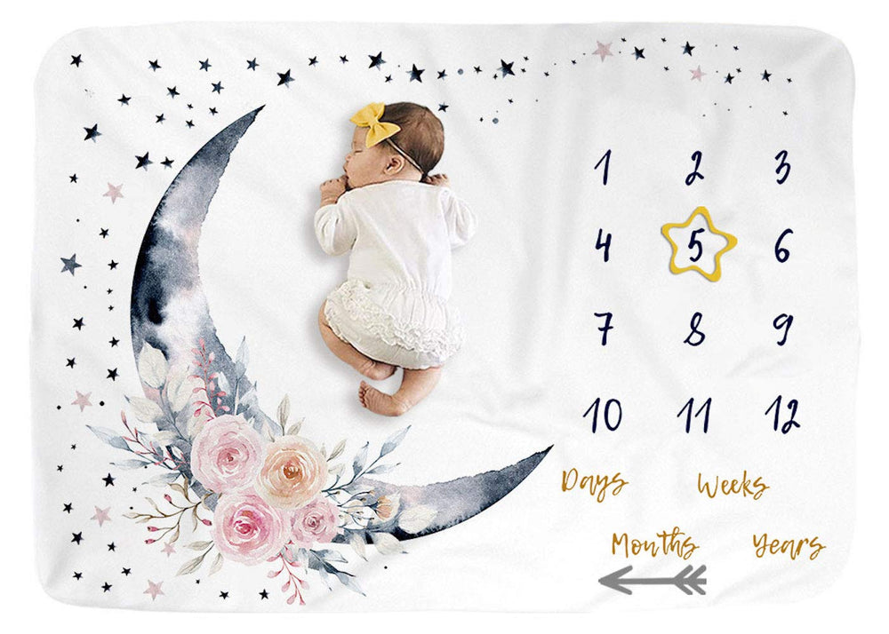 BUTTZO Floral Moon milestone blanket shows monthly growth with arrow markers in plush fleece.