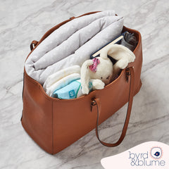 Byrd & Blume Mat showing reversible design options for switchable nursery aesthetics.