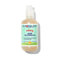 California Baby Calming Hair Detangler Spray bottle pour shows easy dispensing and soothing scent for quick styling.