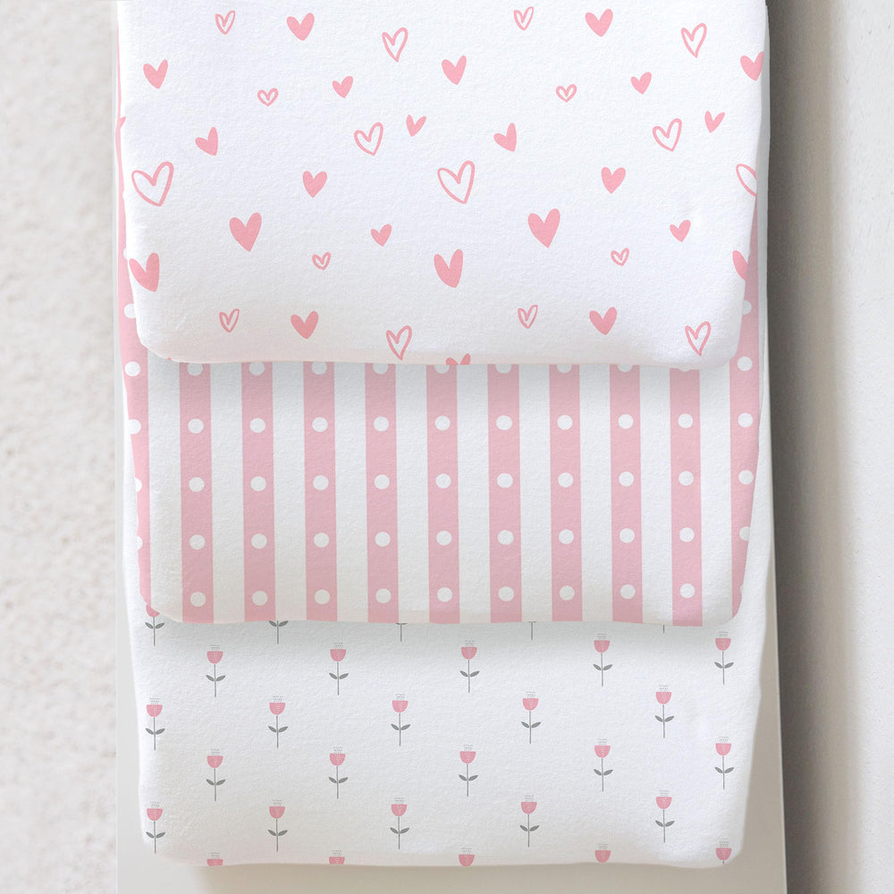 Cambria Baby 3-pack organic cotton changing pad cover on a pad, soft and secure