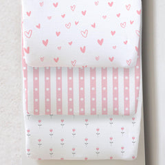 Cambria Baby 3-pack organic cotton changing pad cover on a pad, soft and secure