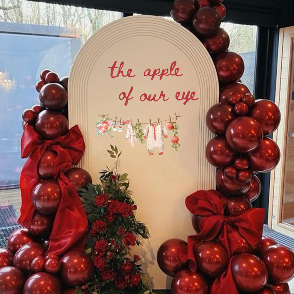 Cantly Apple of Our Eye wall decal creates a festive baby shower backdrop.