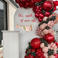 Cantly baby shower apple decal clothesline design enhances gender reveal decor.