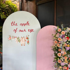 Cantly apple wall decal coordinates with balloons for a cohesive party theme.