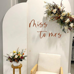 Capiont Miss to Mrs decal on a balloon arch creates a romantic backdrop for photos