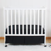 CaSaJa mini pleated black crib skirt with 12-inch drop.