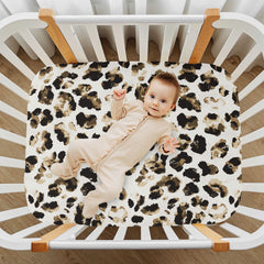 CaTaKu mini crib sheet fit demonstrates secure 360° elastic.