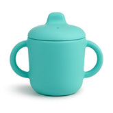 Catii 6 Months+ green-handled sippy cup for easy grip and learning.