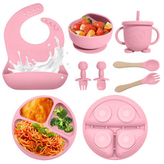 Catvegue pink silicone bib ready to catch spills and drips.