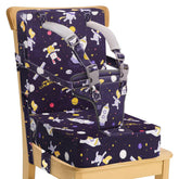 CAVWVTYU booster seat attached to a kitchen chair with secure straps for safe family meals.