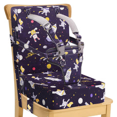 CAVWVTYU booster seat attached to a kitchen chair with secure straps for safe family meals.