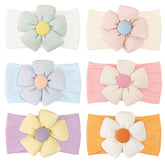 CellLot baby flower headbands in white offer gentle stretch for newborn styling.