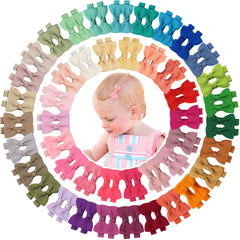 CÉLLOT baby bows close-up on clips showing velvet inner grip keeps hair in place.