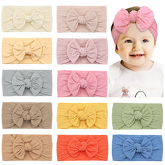 CÉLLOT headbands with bows offer gentle stretch for newborns.