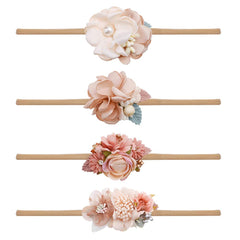 Cherrboll pink flower headband for newborns, ultra soft nylon for gentle wear.