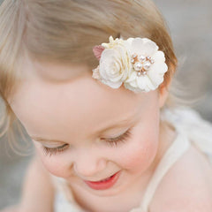 Cherrboll flower clip closeup reveals handcrafted fabric and pearl details