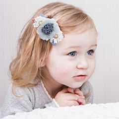 Cherrboll closeup reveals petal textures and handmade details.