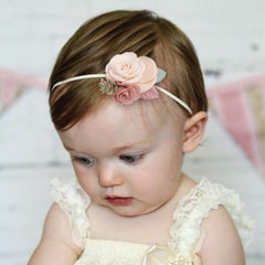 Cherrboll stretchy baby headband adapts from newborn to toddler without slipping.