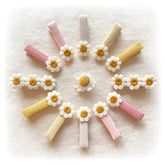 Cherssy daisy clip closeup showing embroidered flower and flat finish for gentle hair