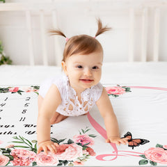Chumia baby girl posing with milestone blanket for photo moments