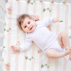 Civarua Kids pink floral nap mat sheet demonstrates secure fit for Regalo My Cot.