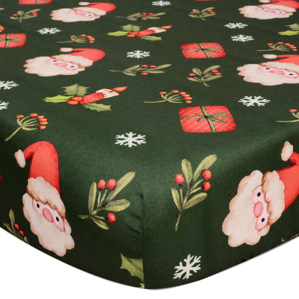 Cloele Christmas Santa crib sheet in green adds festive charm to standard cribs.