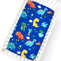 Cloele pattern closeup shows vibrant dinosaur colors for a playful nursery.