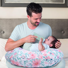 Cloele nursing pillow cover in vivid floral print brightening the nursery