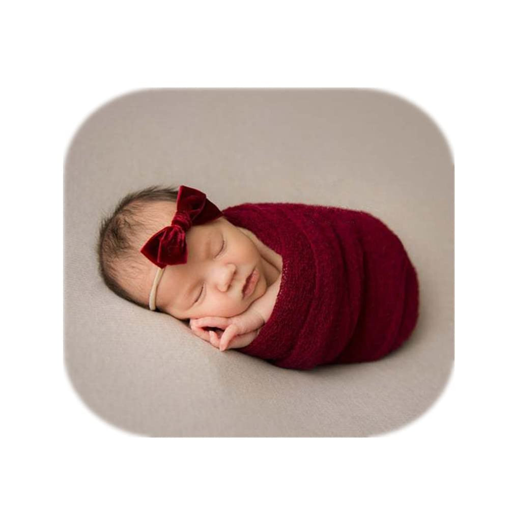 Coberllus newborn wrap red close-up shows soft knit fabric ideal for cozy photoshoots.