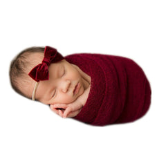 Coberllus newborn wrap red on-baby-portrait shows cozy texture for baby's first photos.