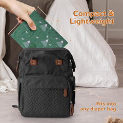 Coinarin portable changing pad open to reveal spacious, soft changing surface.