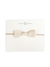 Colored Organics Dainty Bow Headband front view in natural muslin showcases soft organic cotton