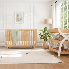 Comfy Cubs convertible crib with toddler bed kit for long-term use.