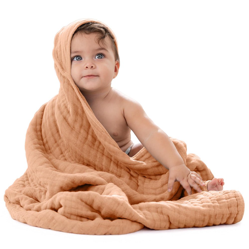 Comfy Cubs hooded towel with 32x32 inch coverage keeps baby warm after bath.